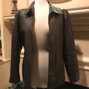 Dark chocolate leather jacket. New w/tags. Lightly lined for a bit of warmth.